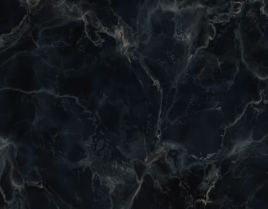 Dark textured marble background with subtle patterns.