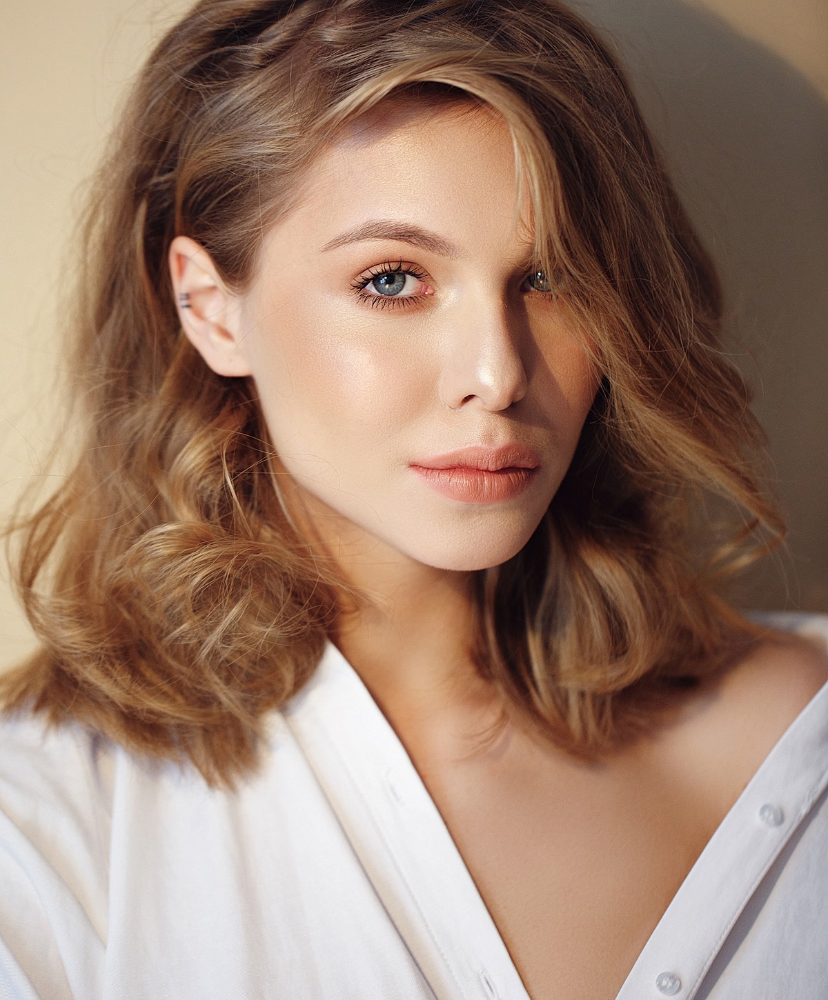 Portrait of a woman with soft, natural makeup.