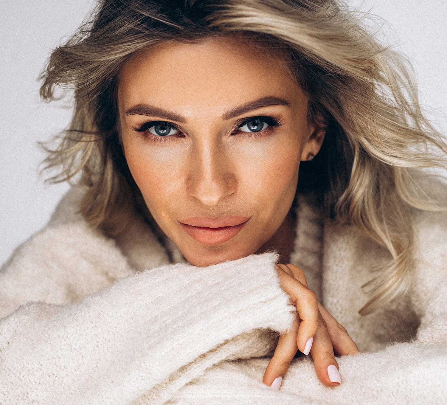 Close-up of a woman with soft features.