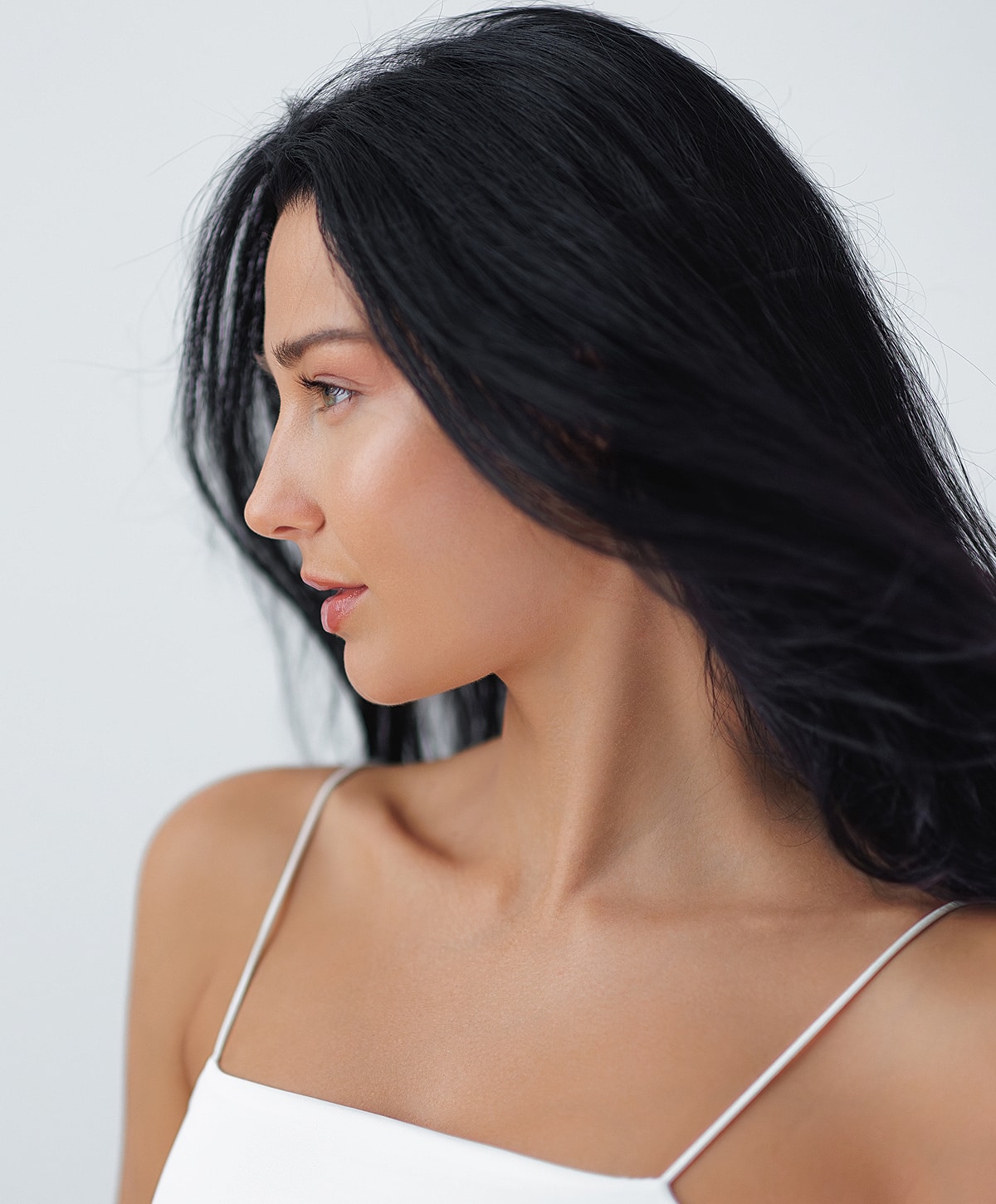 Profile of a woman with long dark hair.