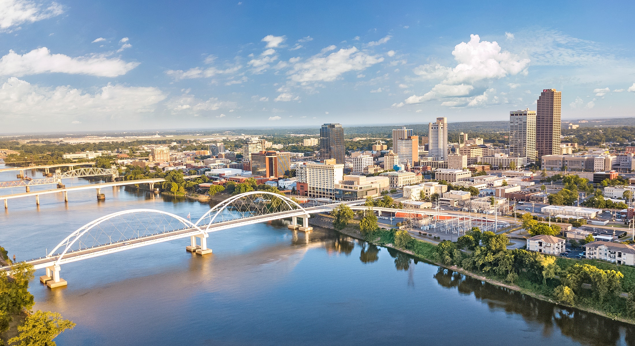 Aerial view of city skyline and river.